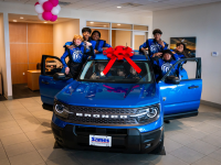  ford bronco sport with students beside it